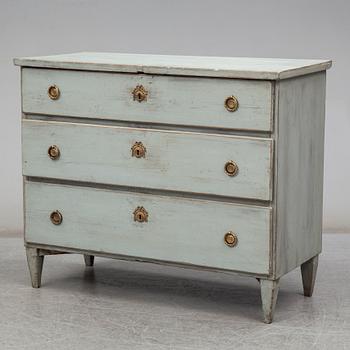 a chest of drawers from the first half of the 19th century.