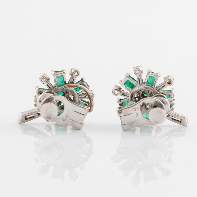 White gold, emerald and round brilliant- and baguette cut diamond ear clips.