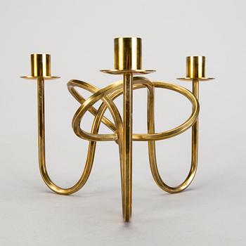 A Josef Frank brass 'Vänskapsknuten' candelabrum from Svenskt Tenn.