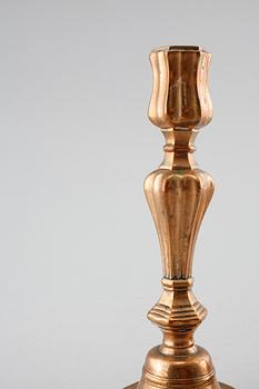 A pair of late barouqe bronze candlesticks, 18th century.