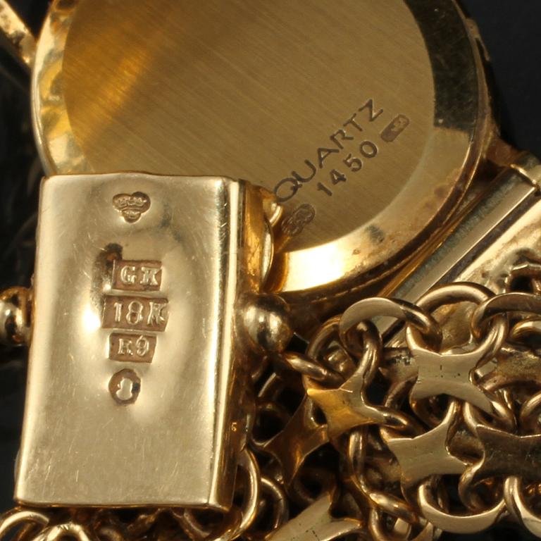 DAMARMBANDSUR, 18 K guld, Omega, omkring 1900-talets mitt. Total vikt 20 g.