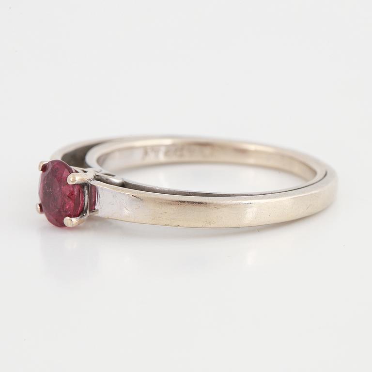 A tourmaline and brilliant cut diamond ring.