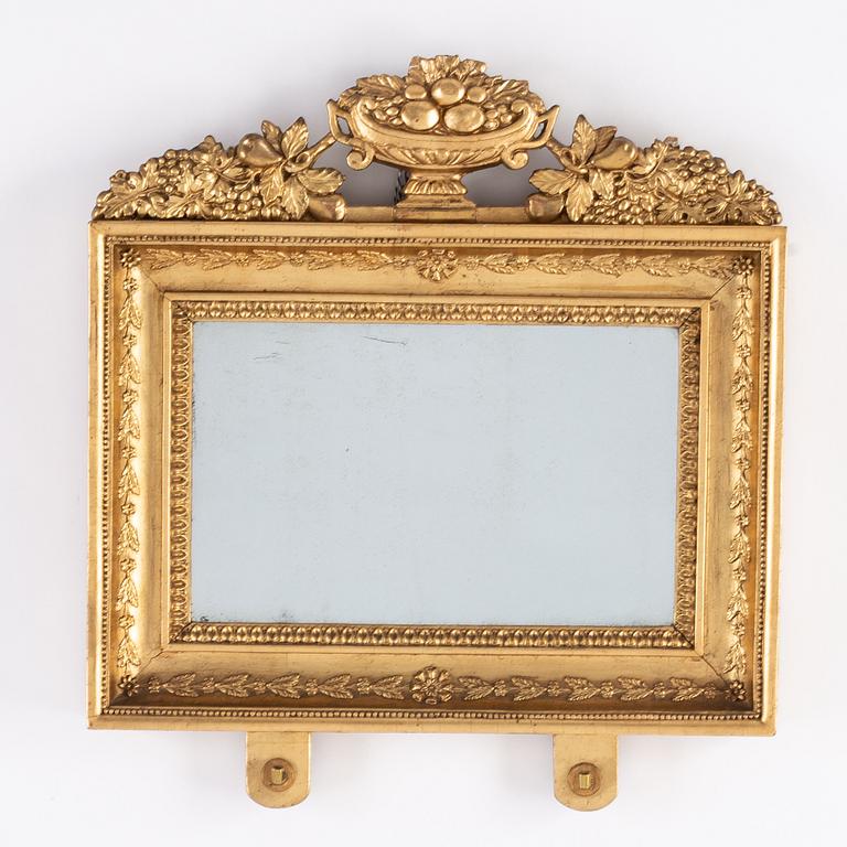 A pair of Swedish Empire mirror wall sconces, first half of the 19th century.
