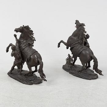 Guilliaume Coustou, after, a pair of bronze sculptures.