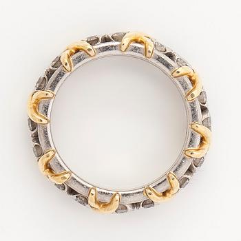 Tiffany & Co, a platinum and 18K gold 'Schlumberger' ring, with brilliant-cut diamonds.