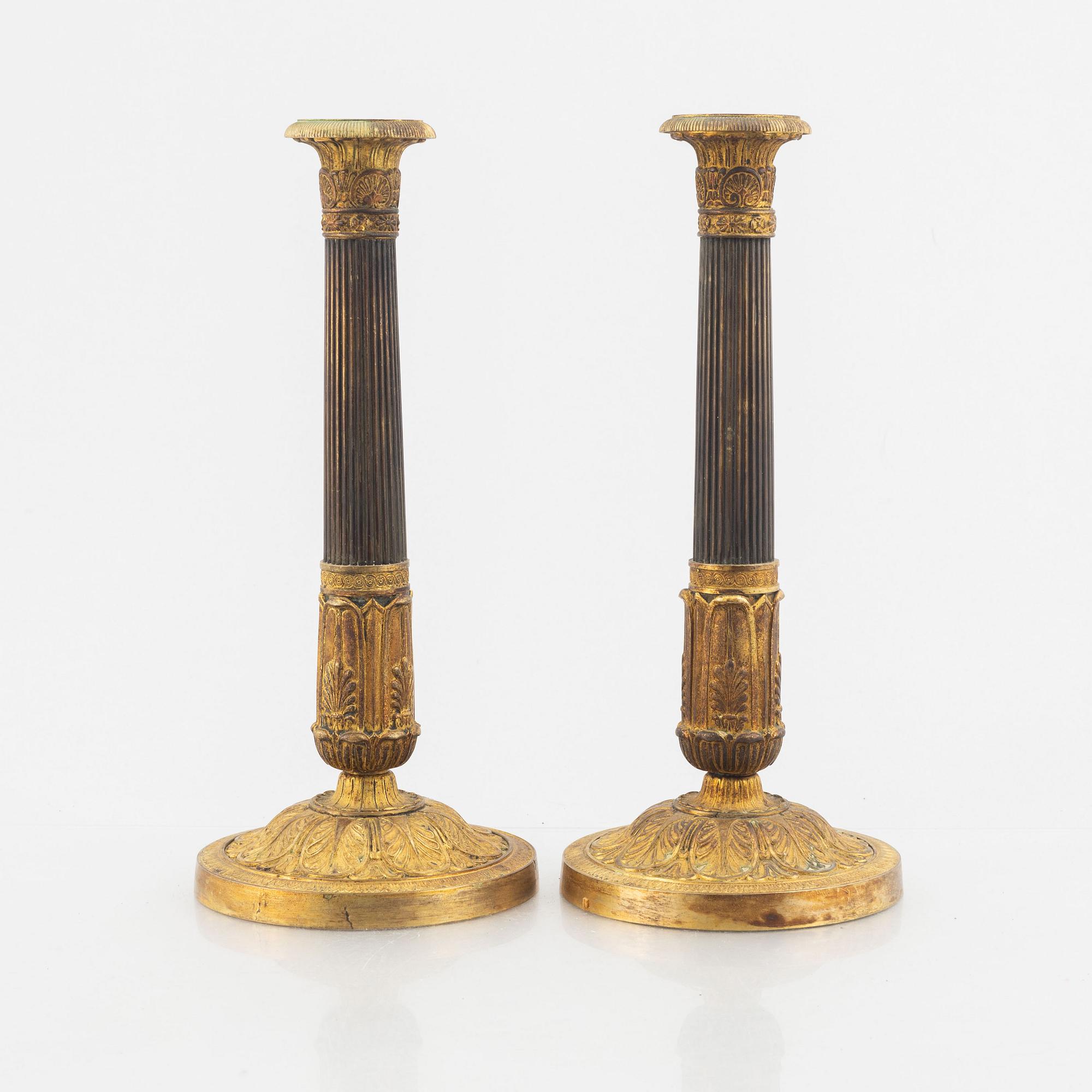 A pair of Empire candle sticks, 19th century.