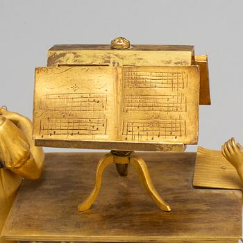 A French Empire gilt bronze mantel clock, first half of the 19th century.