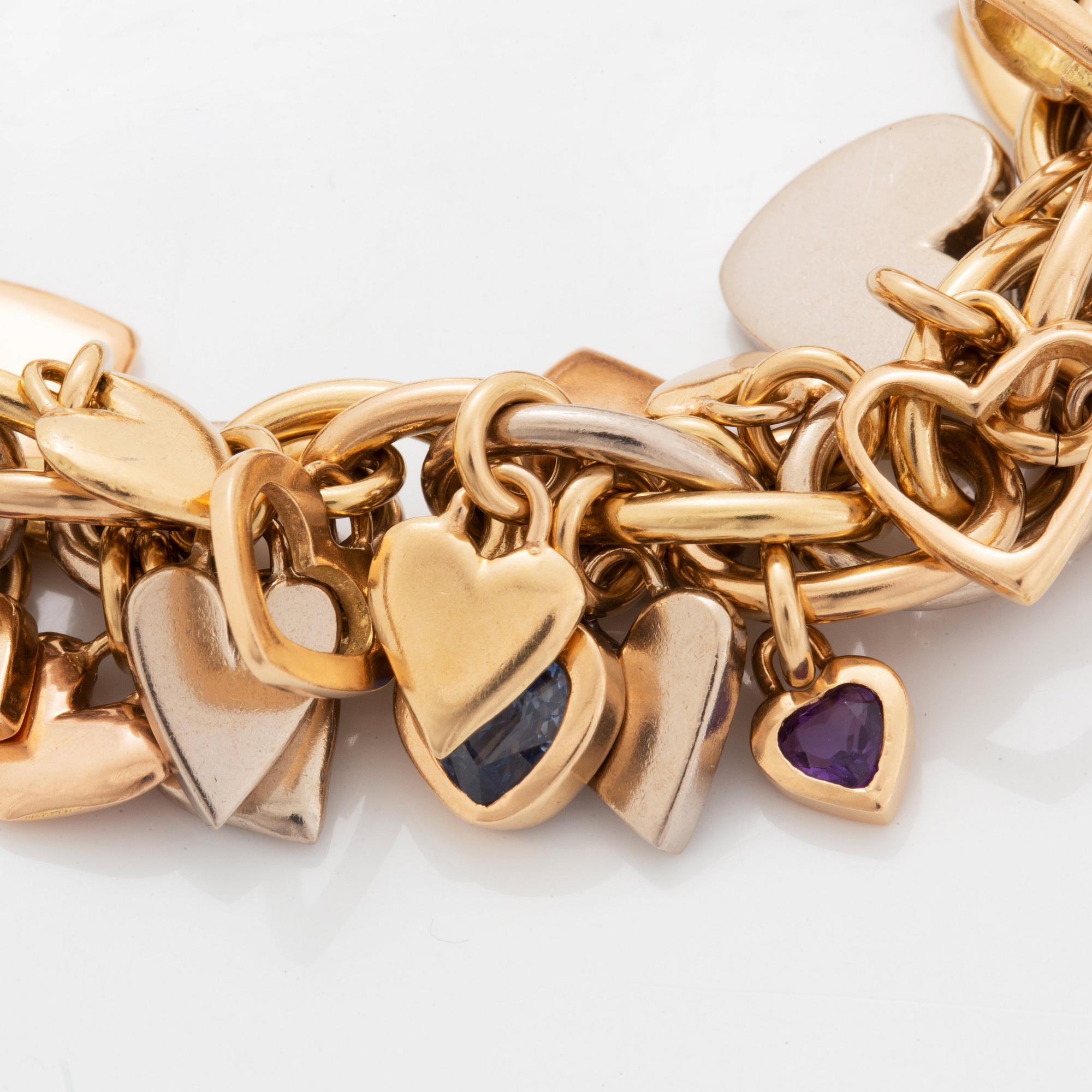 An 18K gold Gaudy bracelet with heart shaped charms.