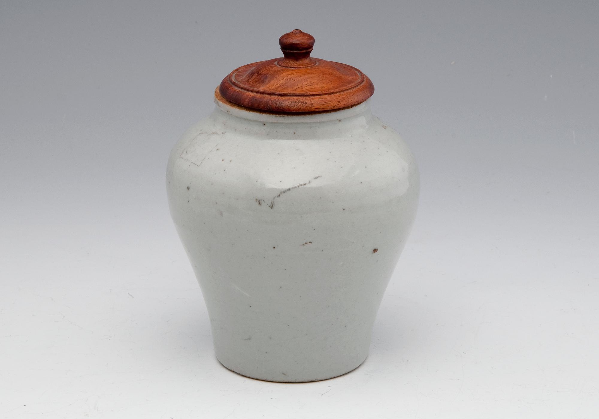 AN URN WITH COVER.