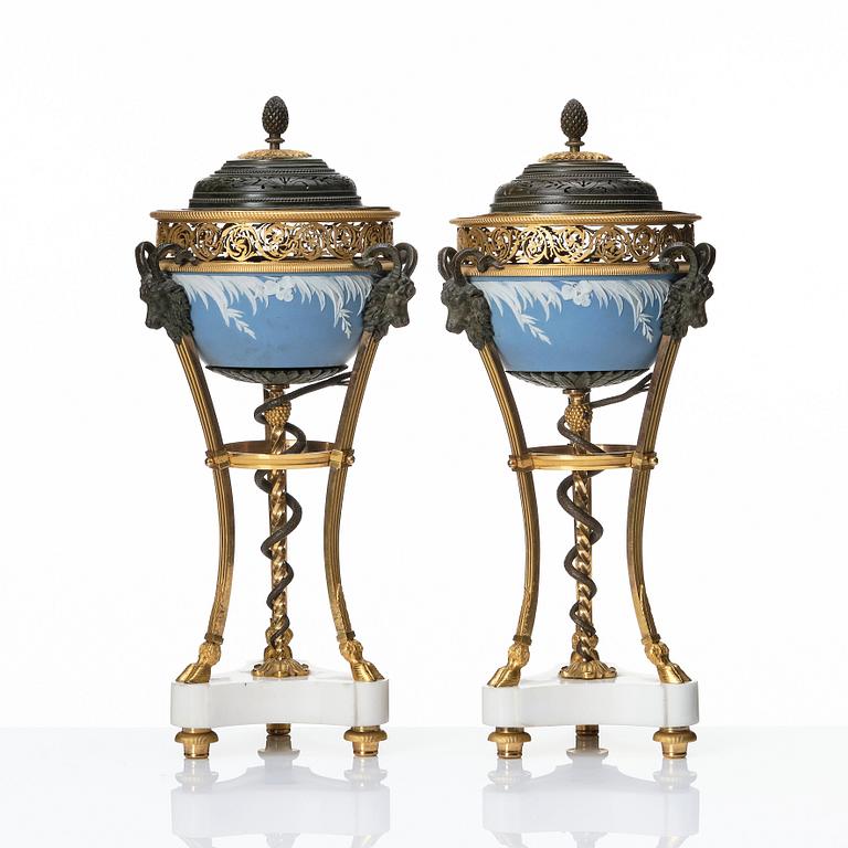 A pair of gilt bronze, marble and ceramic potpourri urns with covers, 19th century.