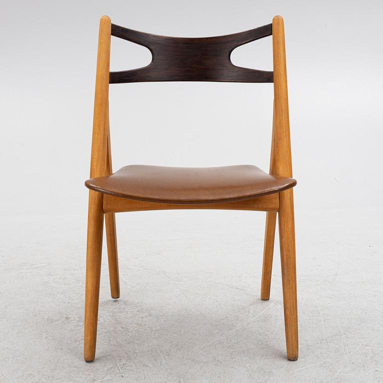 Hans J. Wegner, stol, modell "CH-29"/"Savbukkestolen", Carl Hansen & söner, 1900-talets mitt.