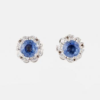 A pair of 14K gold earrings with faceted sapphires and eight-cut diamonds.