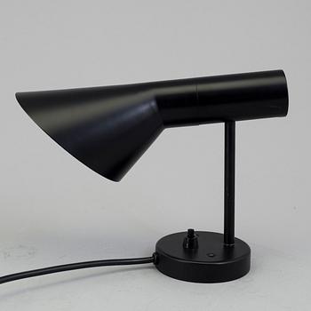 ARNE JACOBSEN, a "AJ" wall light, Louis Poulsen.