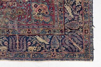 A semi-antique Kerman carpet, c. 325 x 203 cm.