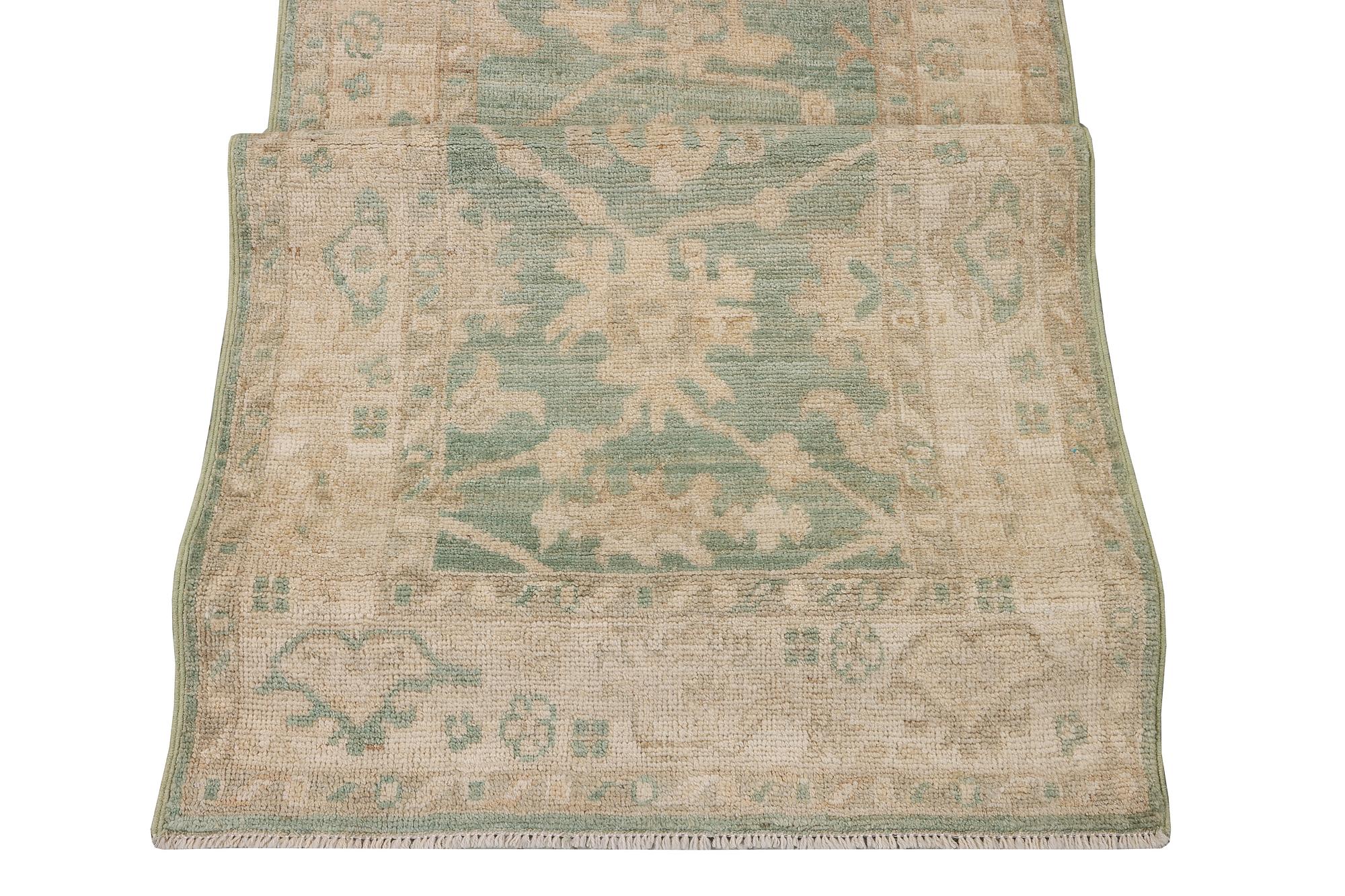 An Ushak runner carpet, c. 293 x 83 cm.