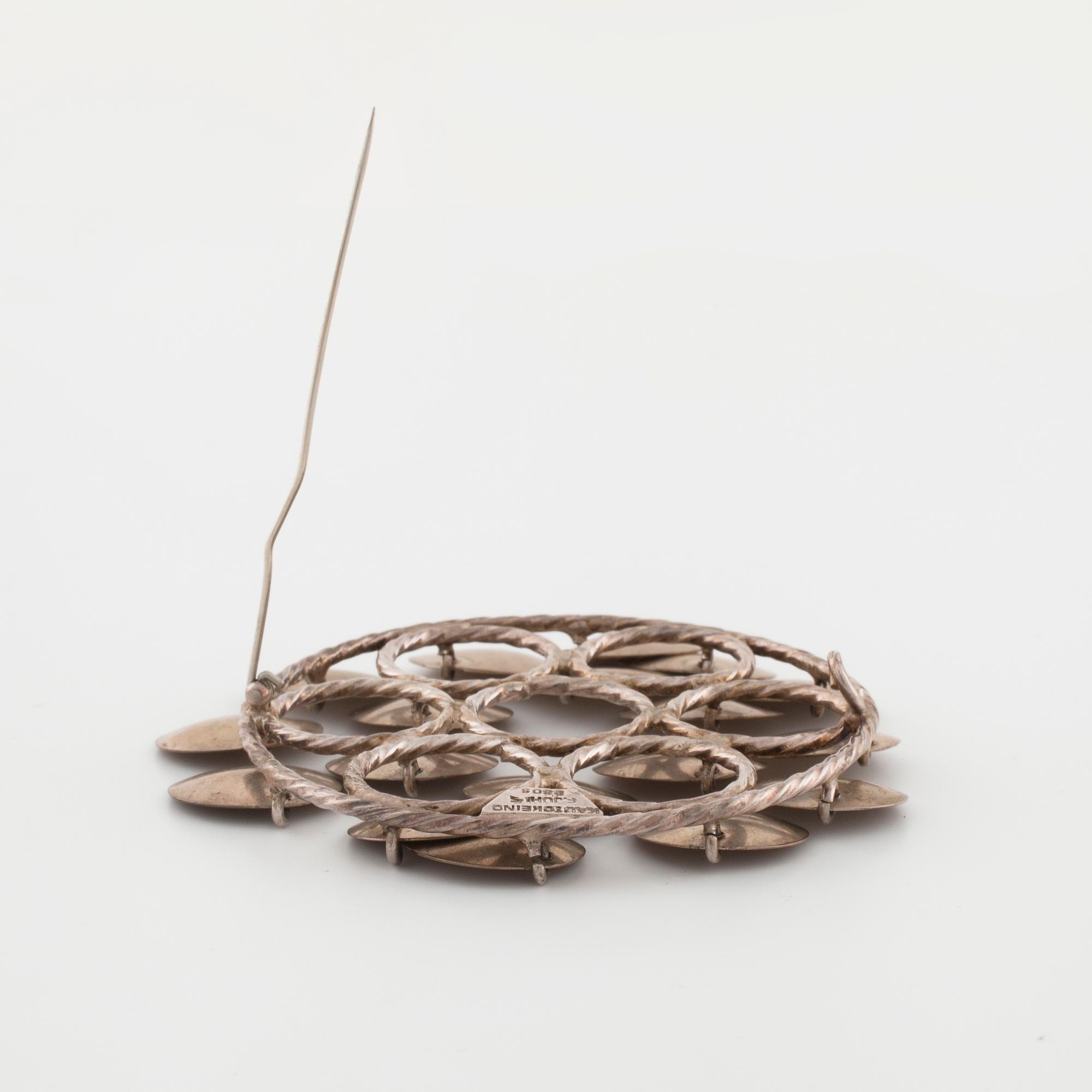 FRANK JUHLS, Kautokeino, Norway, a brooch.