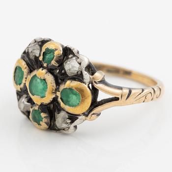 Ring 18K gold and silver set with old-cut diamonds and green stones.