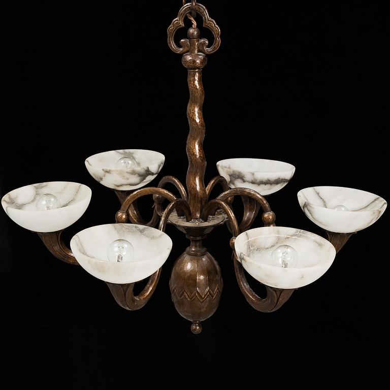 A 1920s-30s copper and alabaster ceiling light.