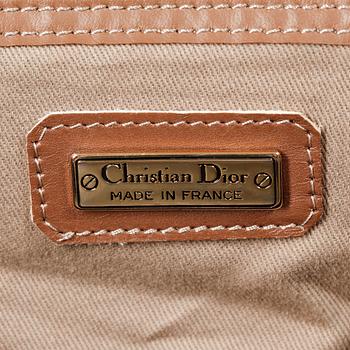 CHRISTIAN DIOR, a brown bag and briefcase.