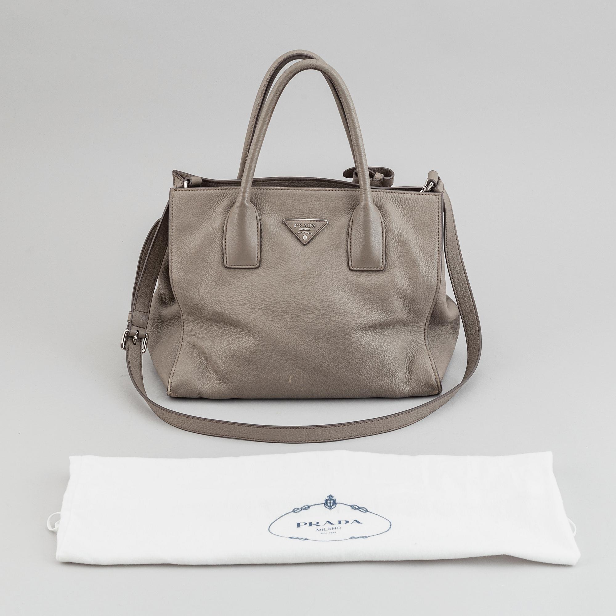 Prada, a leather handbag.