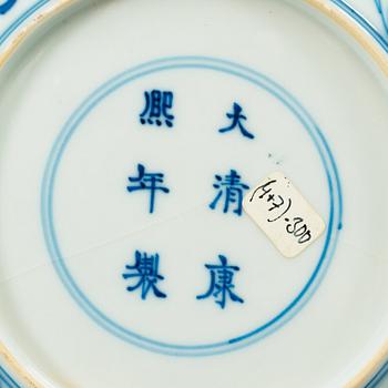 A set of four blue and white lotus dishes, Qing dynasty, with Kangxi six character mark.