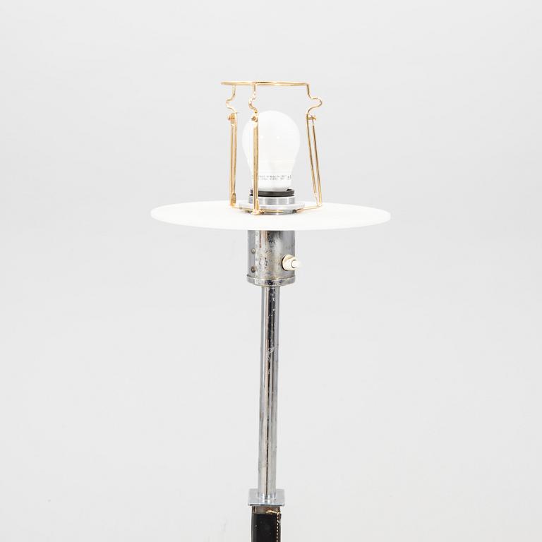 A Philips leather and chrome floor lamp model no 590A later part of the 20th century.