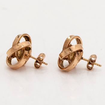 A pair of 14K gold earrings.