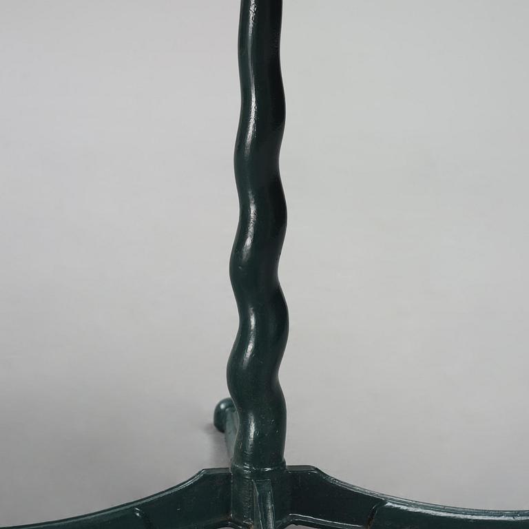 Josef Frank, attributed to, a cast iron table with granite top, Firma Svenskt Tenn, Sweden, 1930s-40s.