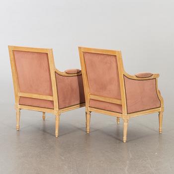 A pair of 20th century gustavian style armchairs.