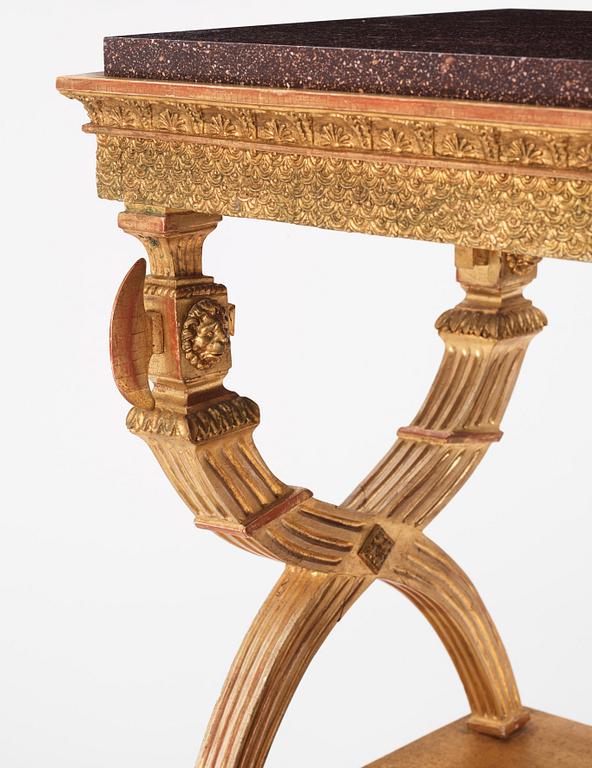 An Empire giltwood and 'Blyberg' porphyry console in the manner of J. Frisk, Stockholm early 19th century.