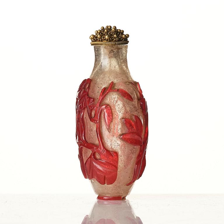 A red overlay Beijing glass snuff bottle, Qing dynasty.