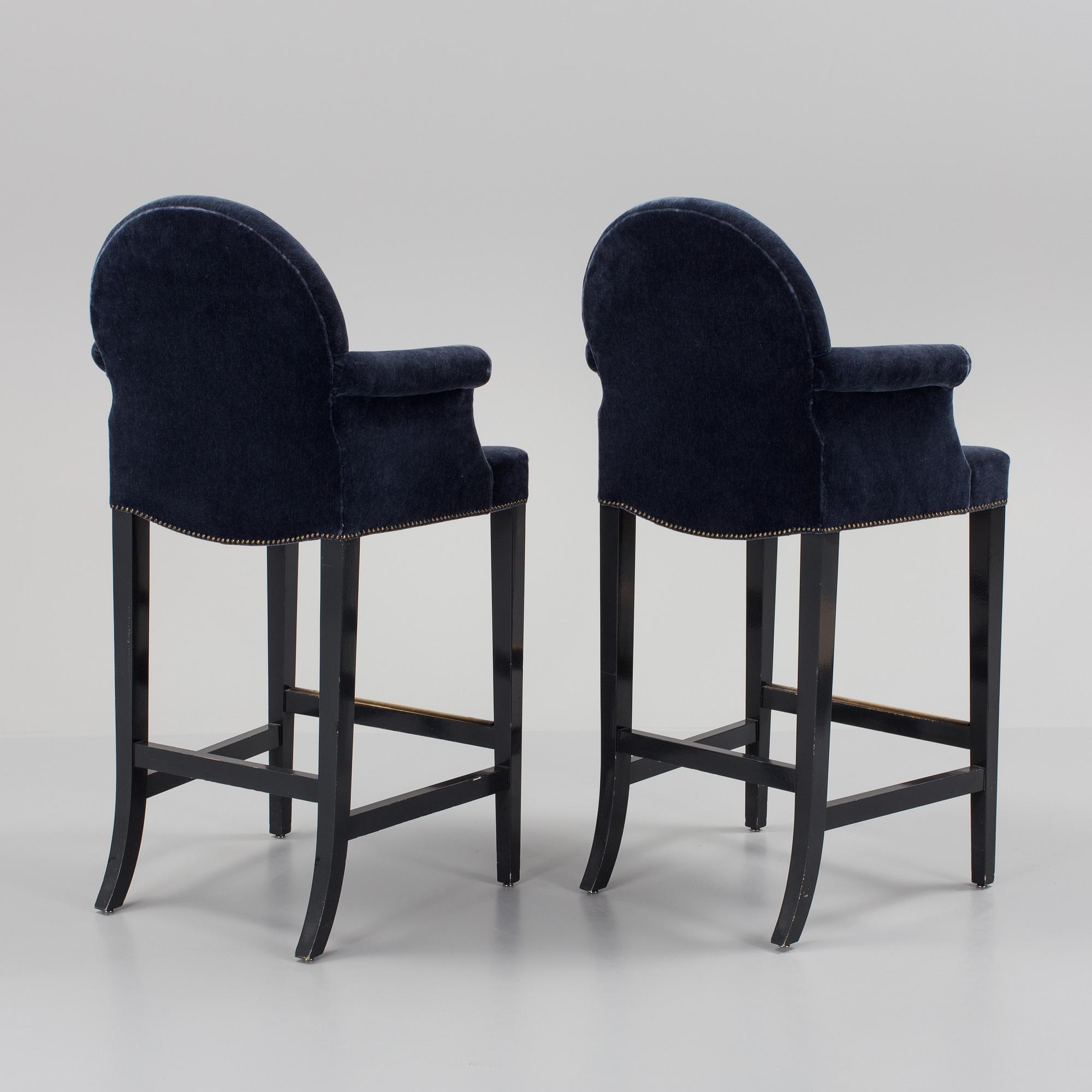 A pair of "The Simplified Moonback Counter Height Stool" barstools by Soane Britain.
