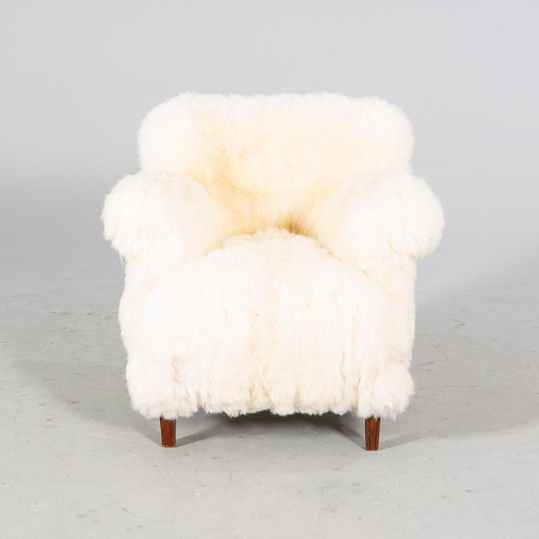 A 1940/50s cheep skin armchair.