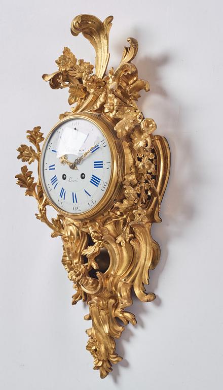 A French Louis XV gilt bronze clock marked Balthazard Paris.