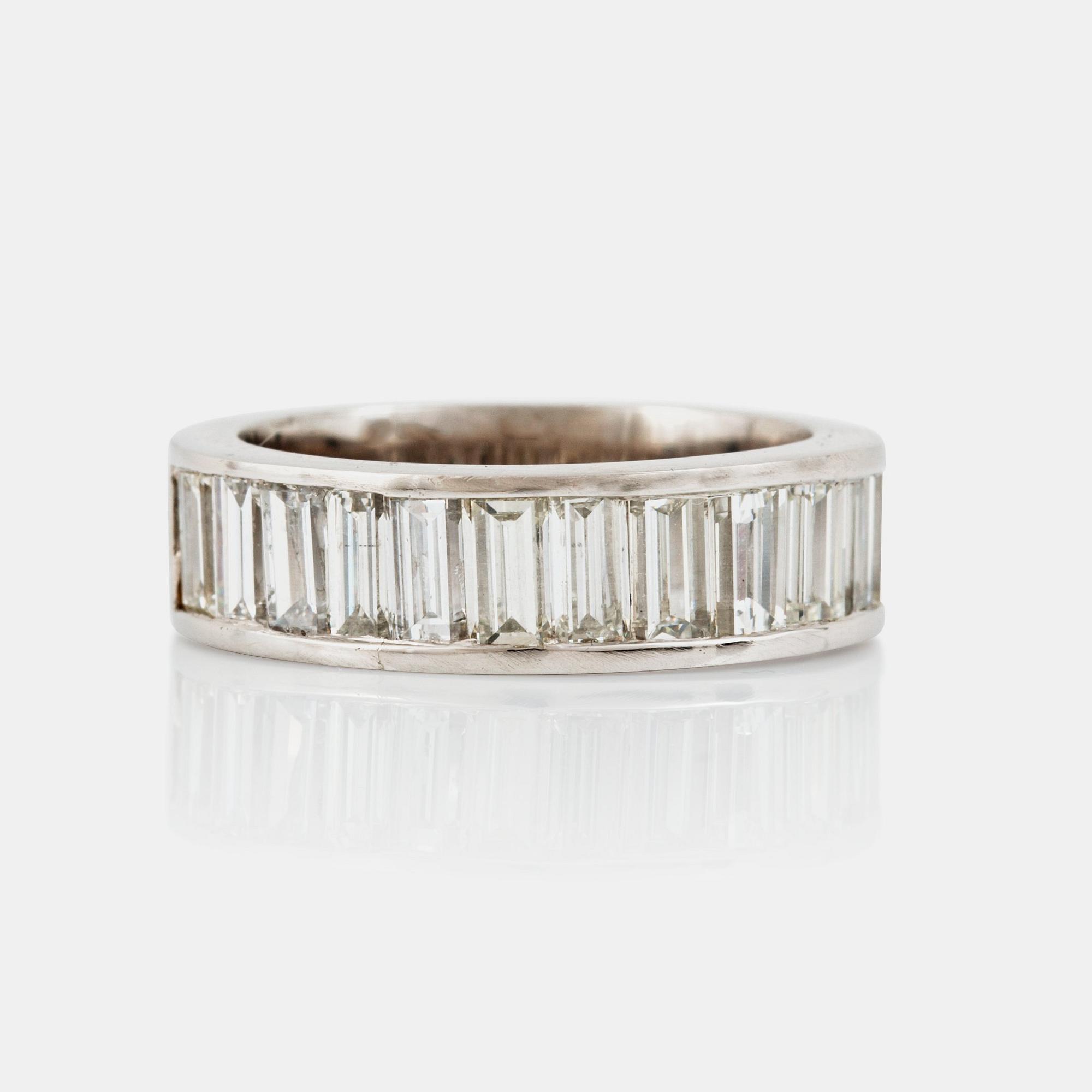 A baguette-cut diamond ring. Total carat weight circa 3.00 cts.