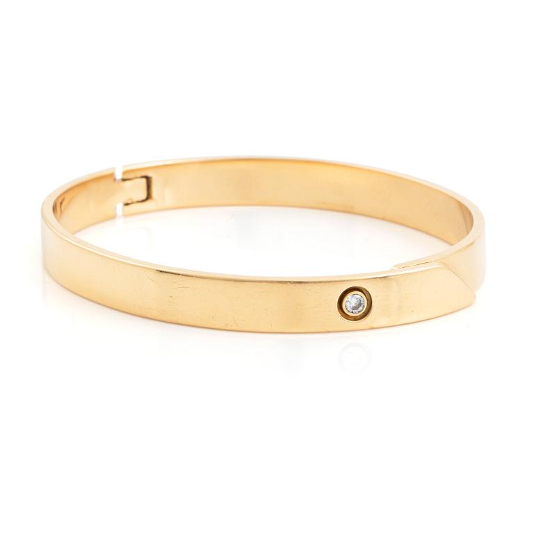 Cartier armband 18K guld med en rund briljantslipad  diamant "Anniversary Bracelet".