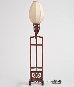 A Chinese wooden floor lamp, later part of the 20th century.