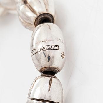 A set of silver "Halikko treasure" necklace, bracelet, ring and earrings. Kalevala Koru, Helsinki 1965-1972.