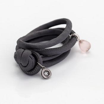 Ole Lynggaard, A silk, rose quartz, diamond 0.015 ct and 18K white gold bracelet. Denmark.