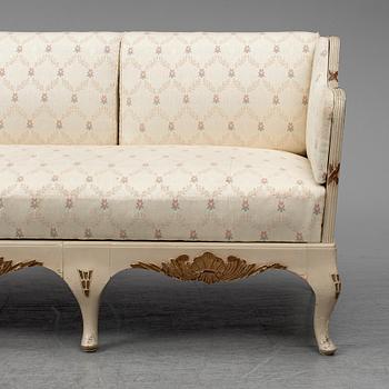 An early 20th century rococo revival sofa.