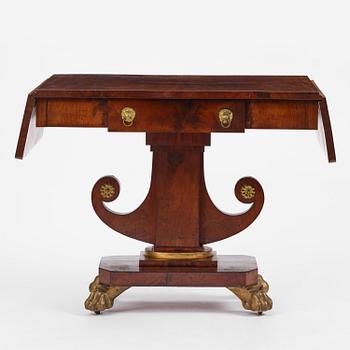 A Swedish Empire mahogany center table.