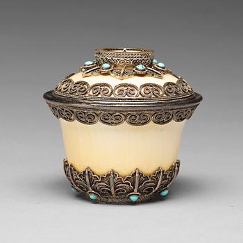 616. A bejewelled tibetan silver and turkoise bowl with cover, 19th Century.