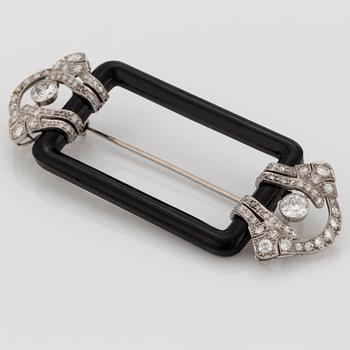Janesich Art Deco brosch med onyx och gammal- och åttakantslipade diamanter.