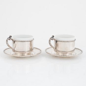 Silver tea mug holders with saucers, Pest, Austria, around 1900.