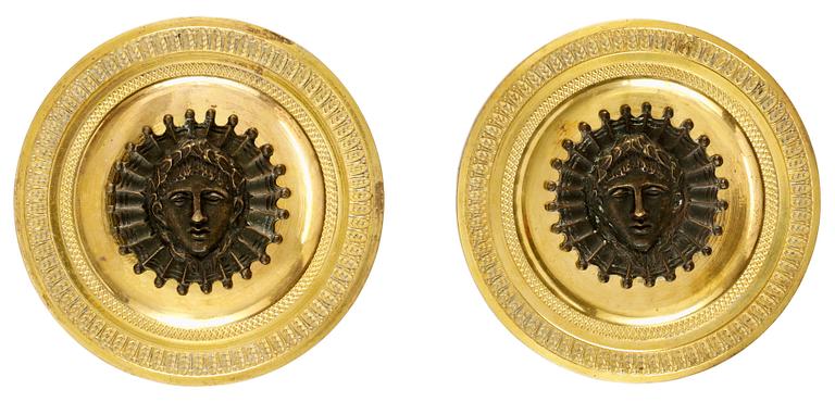 A pair of Empire bronzes for curtain rods.