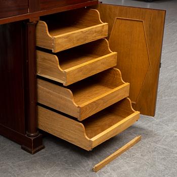 An early 20th century writing desk with chair.