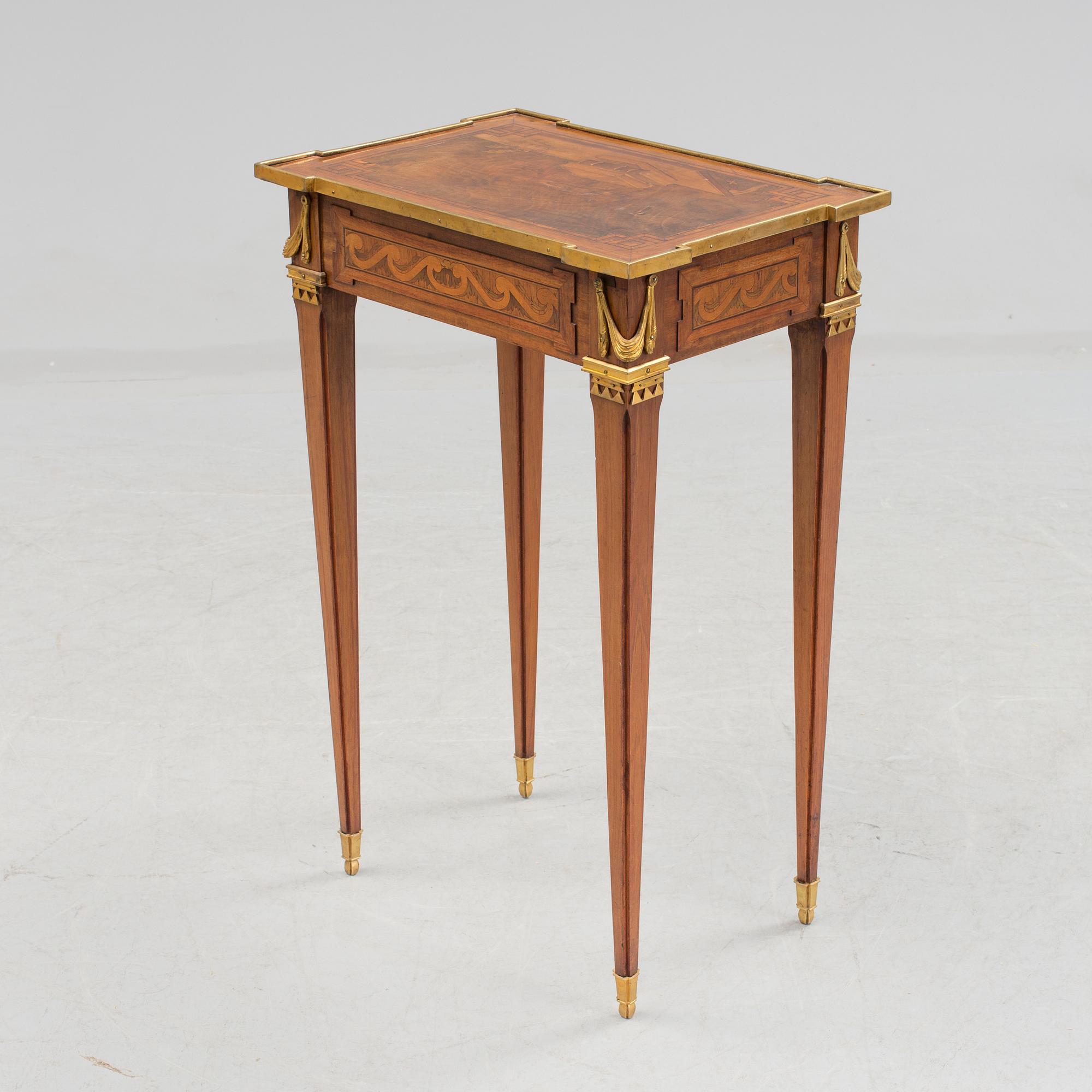 A Louis XVI-style circa 1900 occasional table.