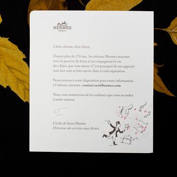 A Hermès cashmere and silk scarf "Tourbillon".