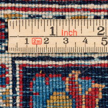 A CARPET, a semi-antique Kashan, ca 314 x 214 cm.