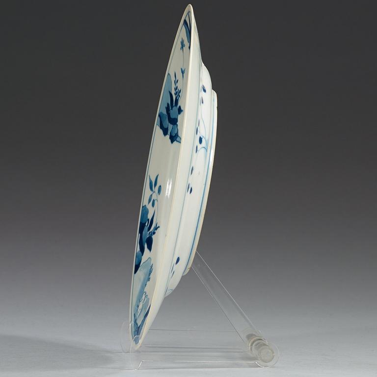 A set of four blue and white dinner plates, Qing dynasty, with Kangxi six character mark and period (1662-1722).